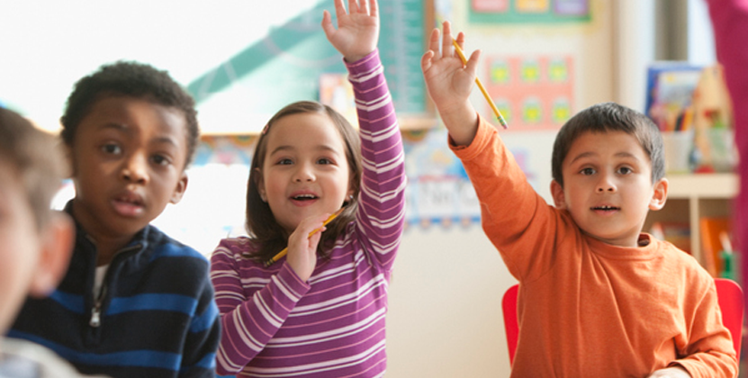 Image of students raising hands Image of students raising hands