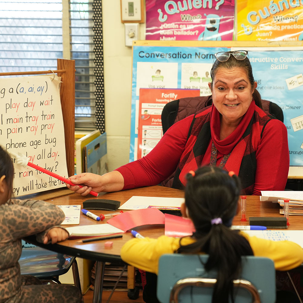 A teacher helping a student.