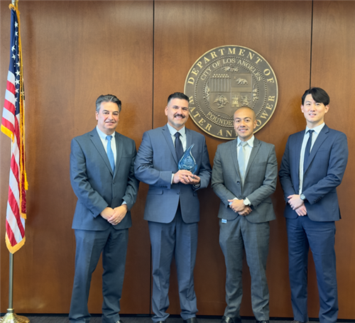 Chief Eco-Sustainability Officer, C. Chrysiliou, and Principal Angulo accepted the Recycled Water Customer of the Year