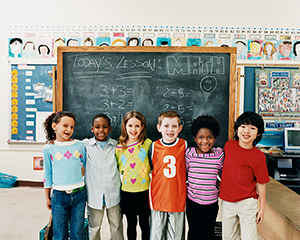 Students in front of a chalkboard 