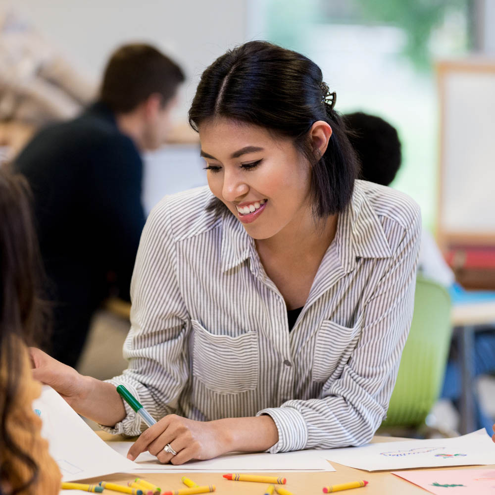 A teacher at a desk