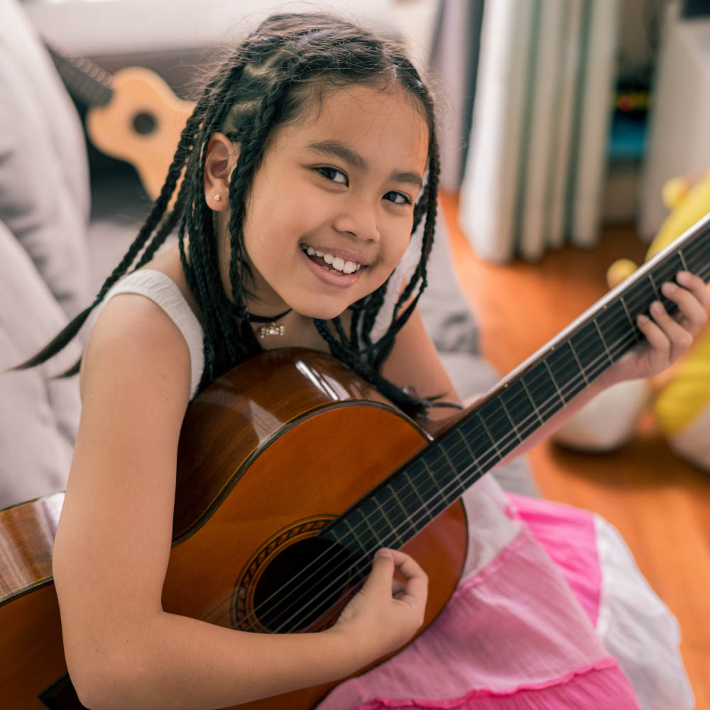 Student playing an instrument