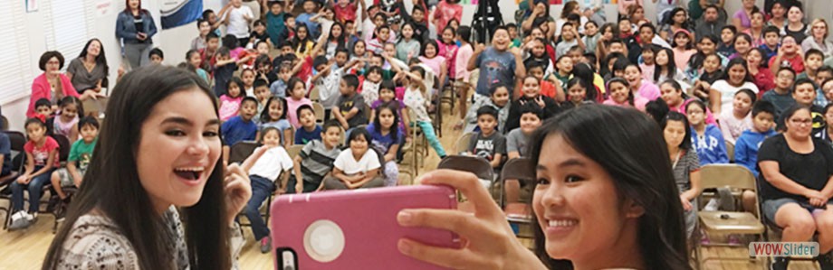 Disney Channel actresses Landry Bender, left, and Tiffany Espensen take a “groupie” with students, parents, and faculty at Griffin Avenue Elementary School