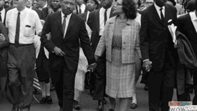 Martin Luther King Jr and Corretta Scott King marching
